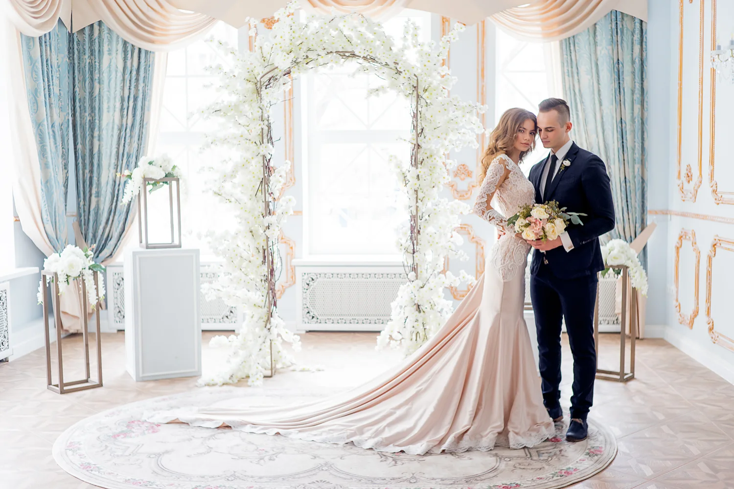 A newly married couple together in an ornate wedding setting